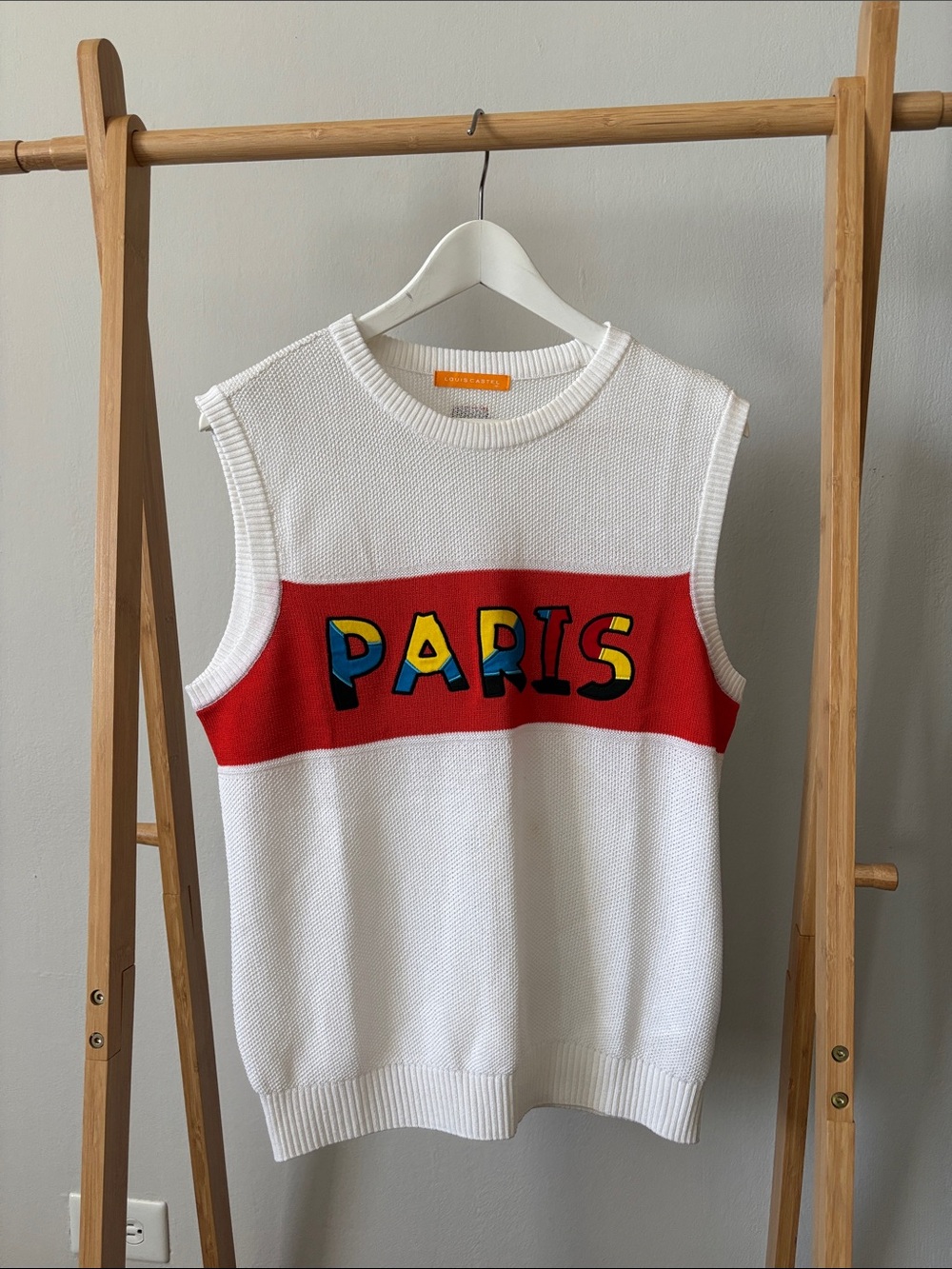 White Sleeveless Paris Knit Sweater Vest with Red Accent